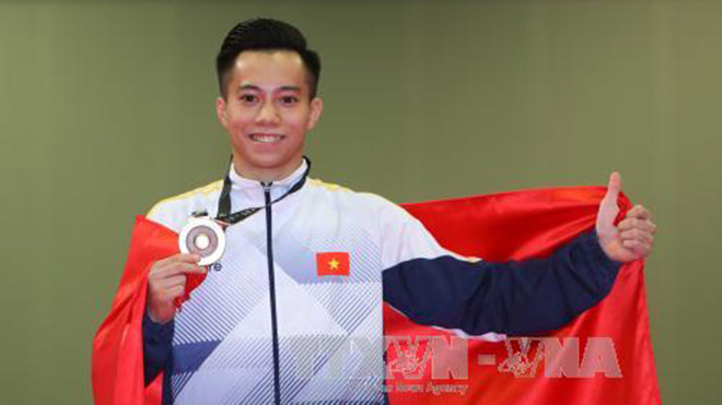 Thanh Tùng là VĐV thứ 2 của Việt Nam chính thức có vé dự Olympic 2020. Ảnh: TTXVN